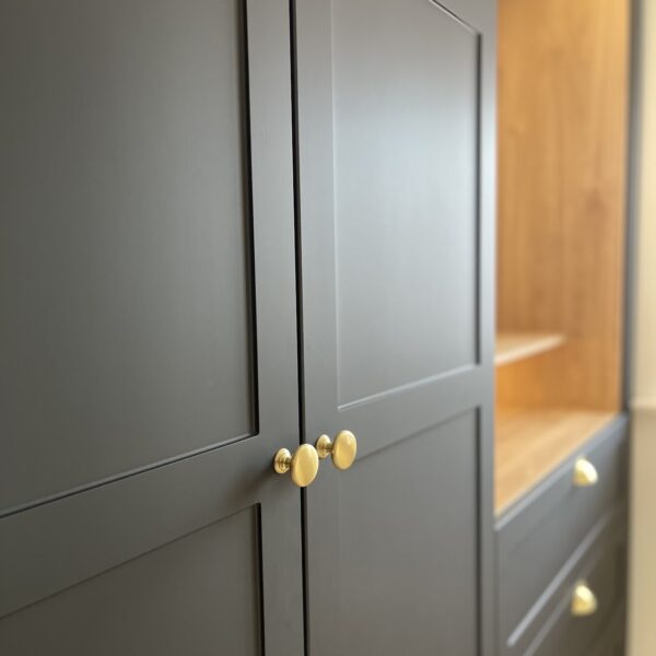 Black wardrobe doors with gold hardware