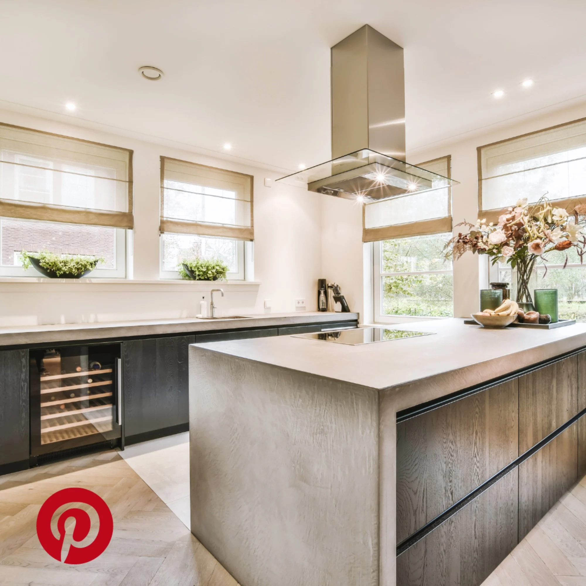 Pinterest luxury kitchen island with integrated countertop hob and extractor fan in ceiling.