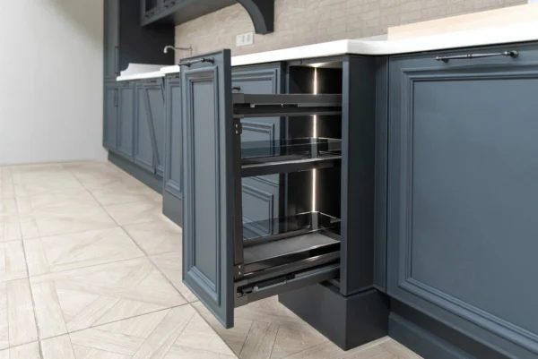 A pull-out spice rack system with multiple shelves is visible, with a warm light strip illuminating the interior.