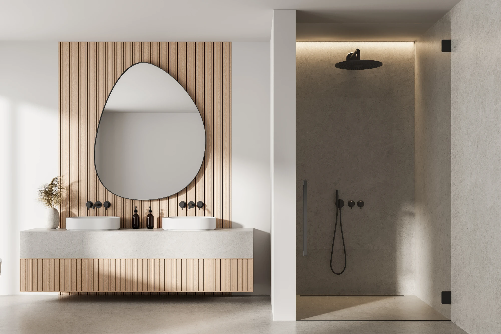 A clean, minimalist bathroom with a double vanity featuring a unique pebble-shaped mirror and a walk-in shower with a black rainfall showerhead. 