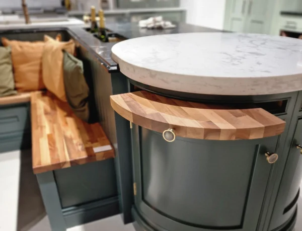 A rounded in frame corner unit in a kitchen with pull-out features.