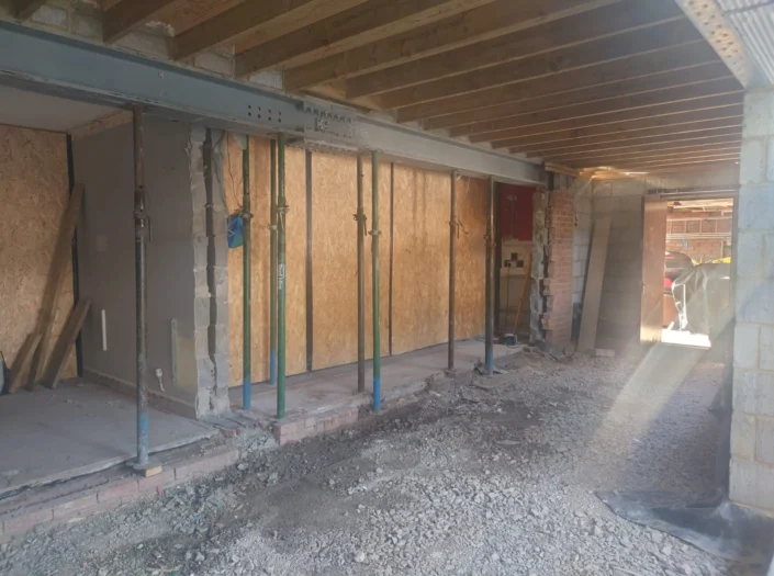 Scaffolding and wood panelling for construction work.